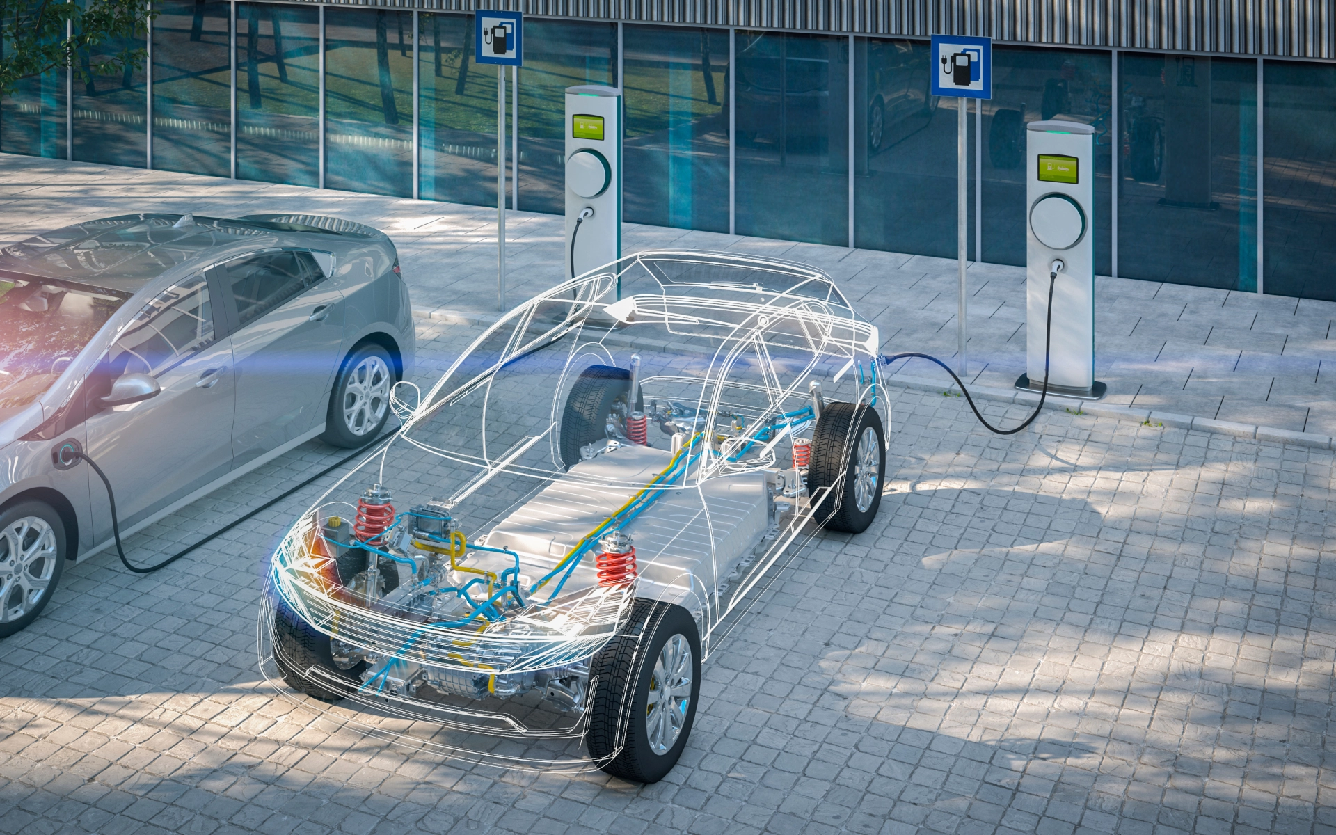 Ein E-Auto wird an einer Ladesäule aufgeladen. Das Fahrzeug ist transparent, sodass man alle technischen Komponenten sehen kann.