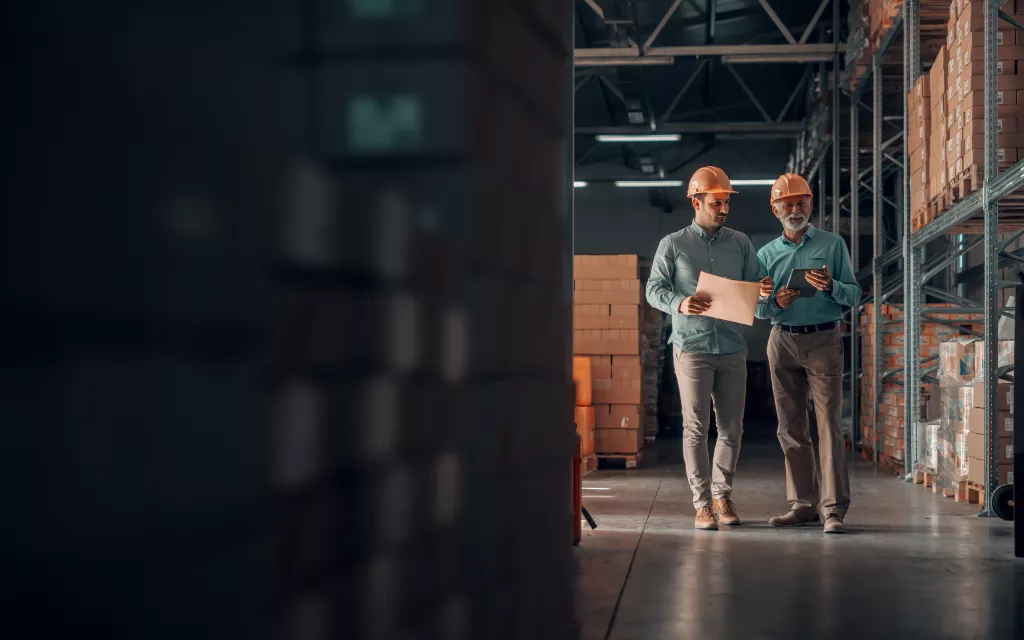 People walk through warehouse