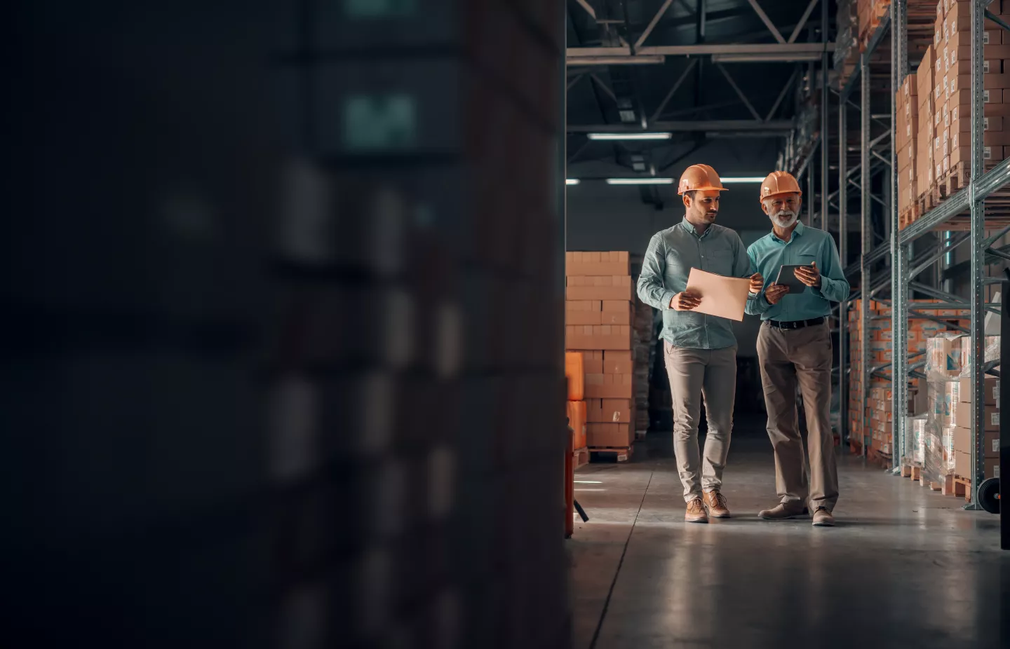 People walk through warehouse
